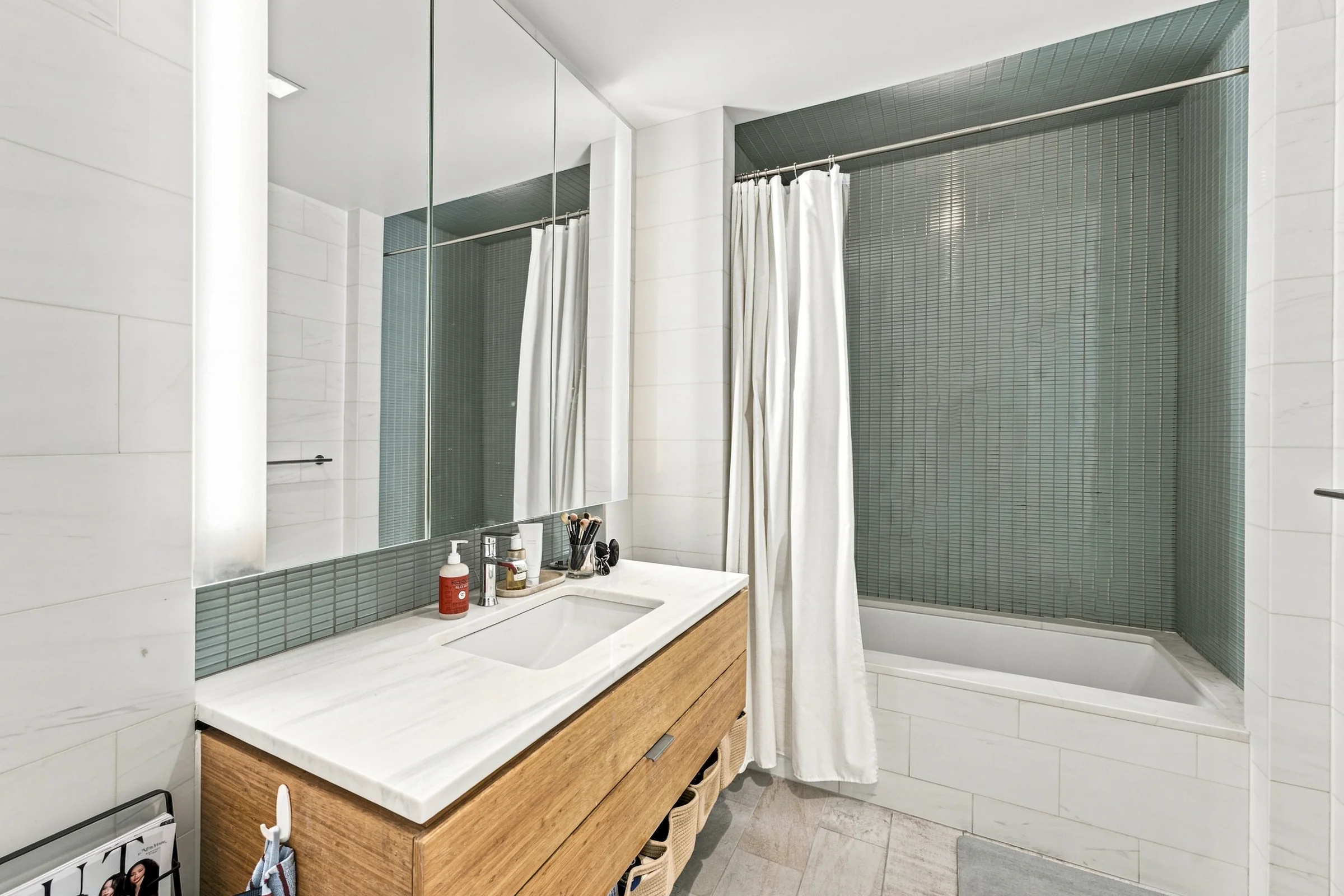 Minimal white bathroom with wood vanity