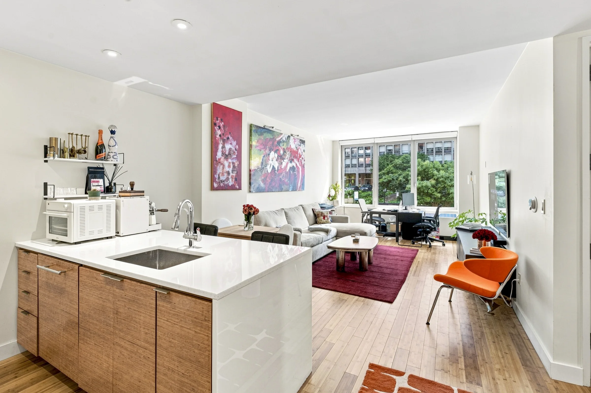 Sunlit Manhattan apartment with an open kitchen and living room